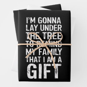 Feuille De Papier Cadeau Cadeaux de famille de Noël sous l'arbre