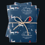 Feuille De Papier Cadeau Christmas Reindeer Nom de famille<br><div class="desc">Ce papier d'emballage de Noël Reindeer Family Name est une jolie scène illustrée de cerfs,  d'arbres et de flocons de neige au-dessus d'un arrière - plan bleu marine. Personnalisez-le : adressez-le à votre proche ou ajoutez votre nom de famille.</div>