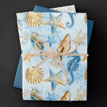Feuille De Papier Cadeau Côte Chic | Moderne bleu et or sous la mer<br><div class="desc">Une aquarelle nautique fantaisiste et poussiéreuse bleu et or "sous la mer" à motif de plage peint à la main apporte une touche moderne à un vieux thème. La collection présente des coquillages, des étoiles de mer, un hippocampe et un récif de corail dans des nuances complémentaires de bleu, d'or...</div>