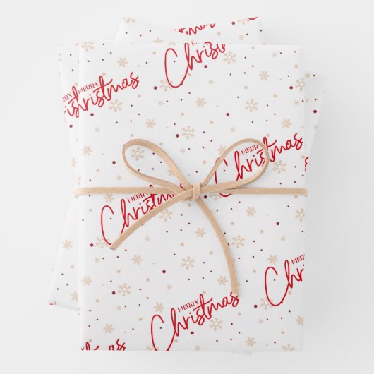 Feuille De Papier Cadeau Joyeux Noël en écriture rouge avec neige dorée (En situation)