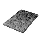 Feuilles blanches sur tapis de bain noir (Angle)