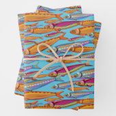 Feuilles de papier colorées enveloppant des poisso (En situation)