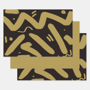 Feuilles de papier d'emballage tribal noir et or