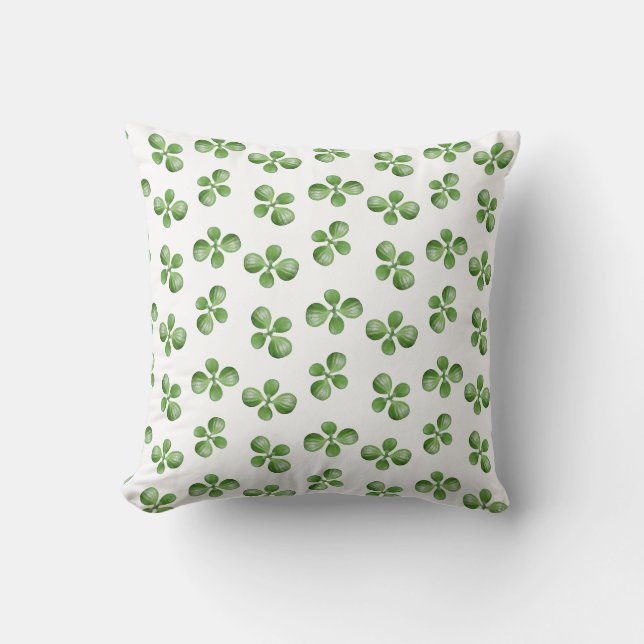 Feuilles de succulente vertes sur un coussin blanc (Recto)
