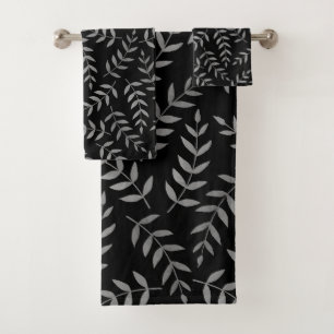 Feuilles grises tropicales élégantes sur fond noir