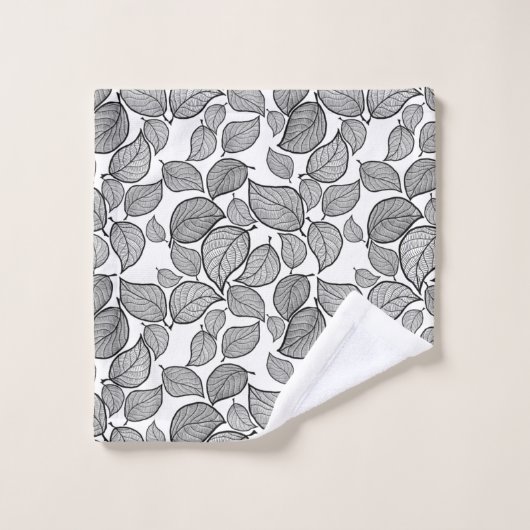 Feuilles noirs sur la serviette blanche (Gant de toilette)