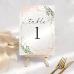 Feuilles verts et numéro de table blanche<br><div class="desc">Superbe look feutré avec des accents de cadre doré et brouillard roux pour séduire vos invités!</div>