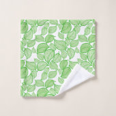 Feuilles verts sur la serviette blanche (Gant de toilette)