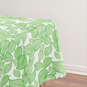 Feuilles verts sur nappes blanches