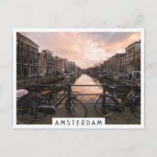 Fietsen op zonsondergang in Amsterdam Briefkaart