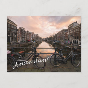 Fietsen op zonsondergang in Amsterdam Briefkaart
