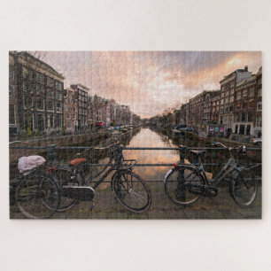 Fietsen op zonsondergang in Amsterdam Legpuzzel