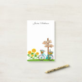 Fietsprogramma met mand bloemen na de presentatie post-it® notes (Op bureau)