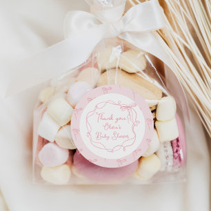 Fijne roze strik handgetekende golvende lijst beda ronde sticker