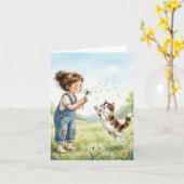 Fille de carte de note soufflant des graines de pi (Fleur jaune)