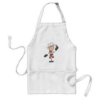 Fille de chef avec le tablier en bois de cuillère