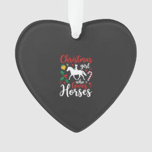 Fille de Noël qui aime les chevaux