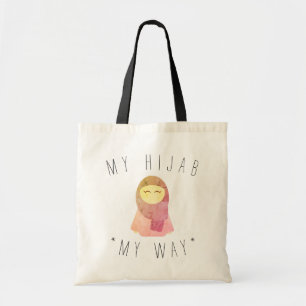 fille musulmane mignonne avec le sac fourre-tout 