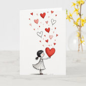 Fille offre une carte de coeurs d'amour (Fleur jaune)