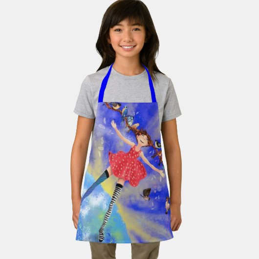 Fillette heureuse avec tablier pour enfants oiseau (Insitu)