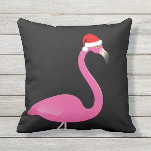 Flamant rose de Père Noël sur le coussin extéri
