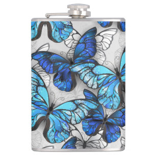 Flasques Composition des papillons blancs et bleus