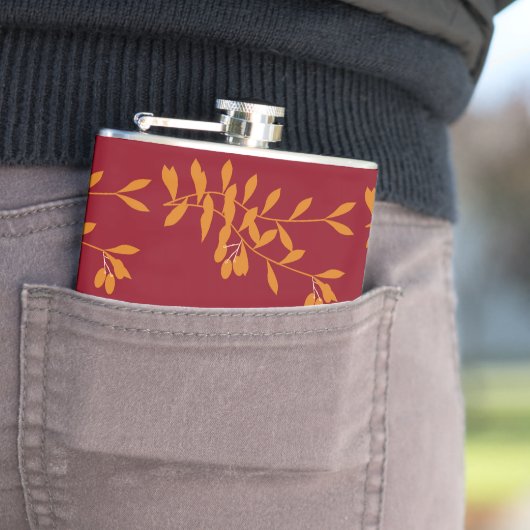 Flasques Feuilles de branches de silhouette orange sur roug (En situation)