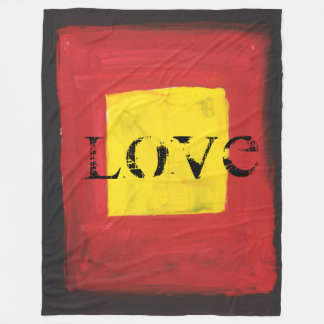 Fleece Deken zwart, rood en geel.