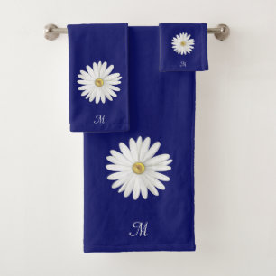 Fleur blanche et monogramme sur bleu marine