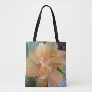 Fleur d'hibiscus orange sur un sac fourre-tout