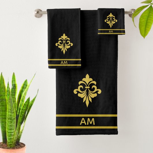 Fleur dorée élégante, monogramme et rayures sur fo