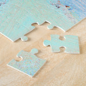 Fleur étoile orange rouge sur puzzle bleu (Côté)