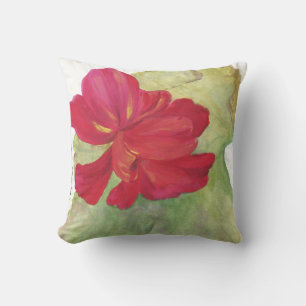 fleur rouge sur coussin blanc