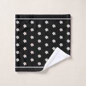 Fleurs de frangipanier blanches sur fond noir (Gant de toilette)