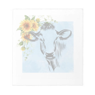 Fleurs de soleil et vache sur le bloc-notes