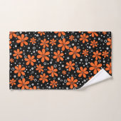 Fleurs orange vif sur un arrière - plan noir avec  (Serviette à main)
