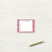 Fleurs roses sur un post-it rouge (Sur un bureau)