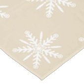 Flocons de neige blancs sur la nappe beige de Noël (Angle)