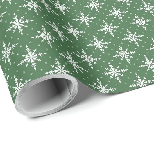 Flocons de neige blancs sur un papier cadeau vert (Coin rond)