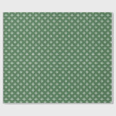 Flocons de neige blancs sur un papier cadeau vert (Plat)
