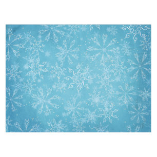 Flocons de neige sur la nappe bleue