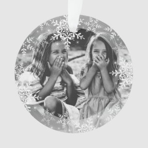 Flocons de neige sur l'ornement de Noël de photo d