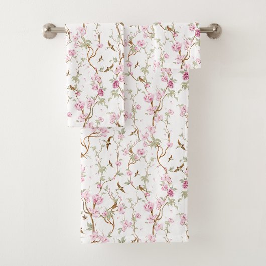 Floral-patterned towels hang neatly