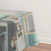 Fluffy kitten met blauwe boog bij banketbakkerij tafelkleed (Voorbeeld)