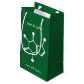 Forces attractives dans le sac cadeau vert (Dos Angle)