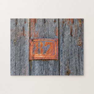 Foto: Old Grunge Rusty Metal House Number. 87 Legpuzzel