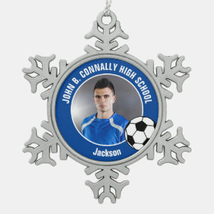 Foto van blauwe voetballer met spirit van de midde tin sneeuwvlok ornament
