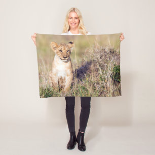 Foto van Cute lion cub in Afrika Fleece Deken