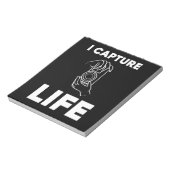 Fotograaf vangt leven notitieblok (Gedraaid)