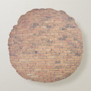 Fotografie van bruinbakstenen rond kussen